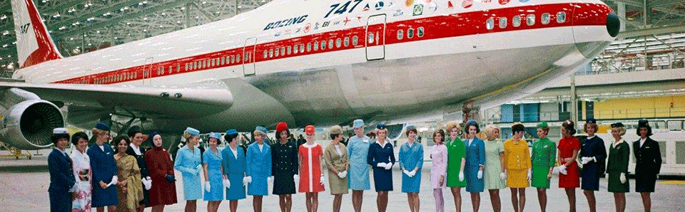 Historical image of 747 with women standing in foreground.