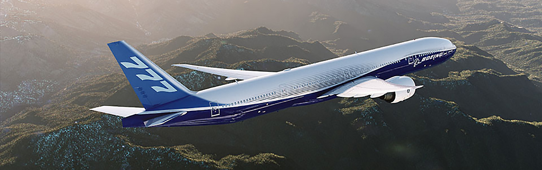 777 in Boeing livery in flight